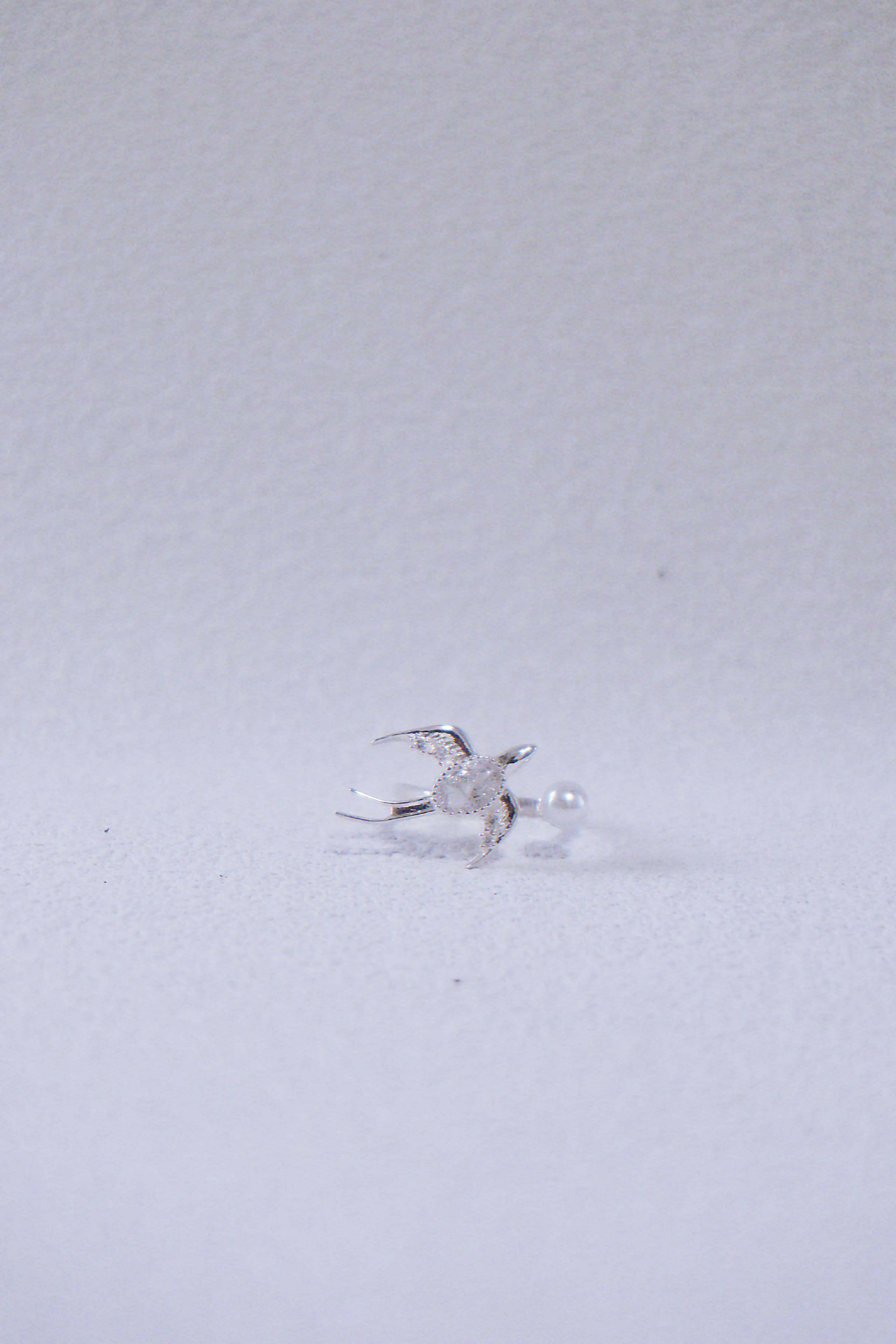 The Messenger. Sterling Silver Winged Swallow Ring with Pearl Accent