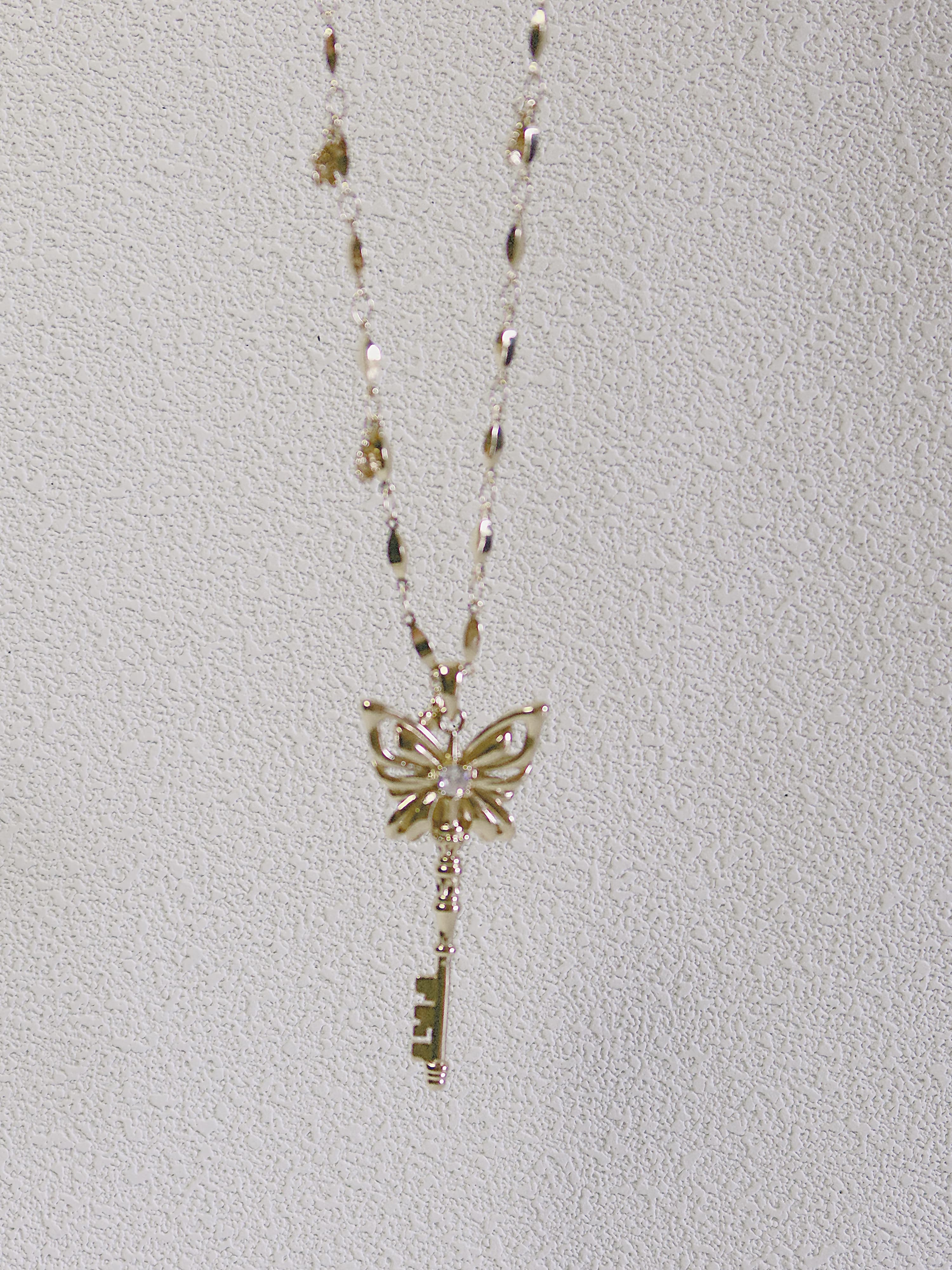 The Butterfly Key. Radiant Pendant Necklace