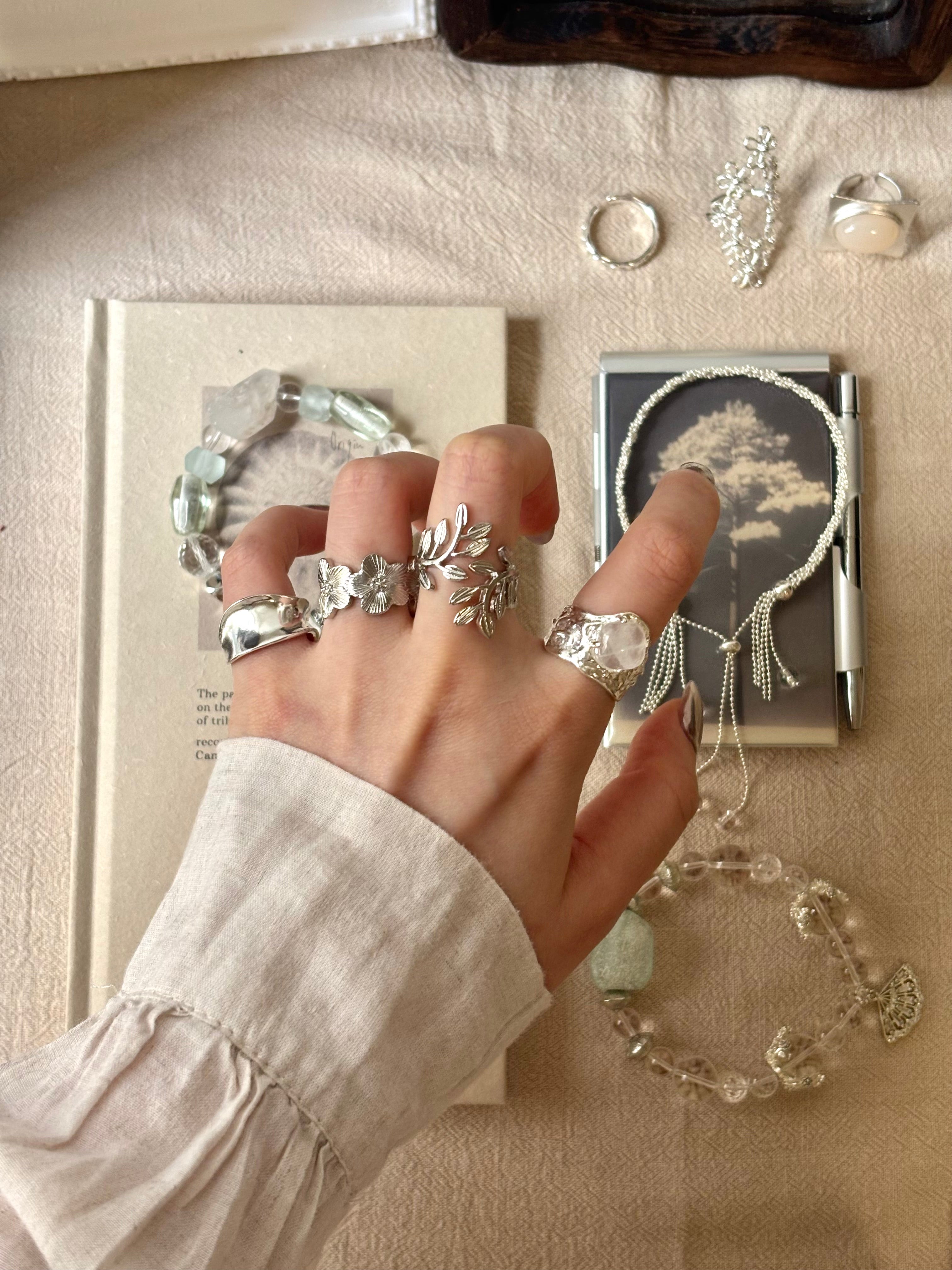 Laurel leaf ring among vintage silver jewelry pieces