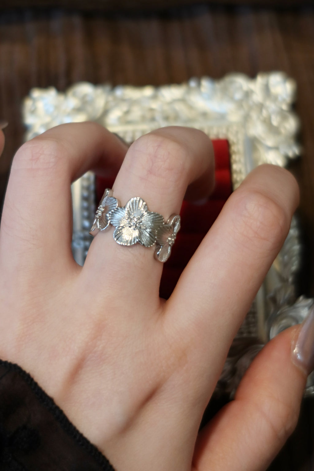 Antique silver wild rose ring with textured blossom petals.